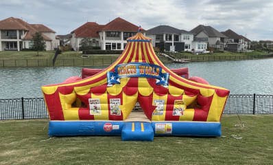 Circus Toddler bounce house in front of Lake
