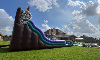 Backyard Water Slide for Rent next to a pool