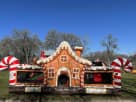 Gingerbread Wonder Playland bounce house rental in Houston features a slide and popup structures, perfect for Christmas parties