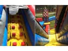 Dual-tunnel obstacle course rental in Houston with kid-friendly rock wall, ideal for carnival-themed parties in Katy.