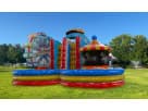 Colorful carnival-themed obstacle course rental in Houston with rock wall and slide, ideal for Spring birthday parties