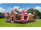 Gingerbread Wonder Playland bounce house rental in Houston with candy decorations and slide, perfect for The Woodlands holiday