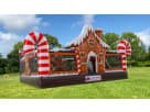 Gingerbread Wonder Playland bounce house rental in Houston with candy cane decorations and slide, ideal for Christmas parties