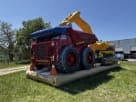 Construction tractor bounce house rental in Houston features a bright yellow excavator arm, ideal for Katy parties.