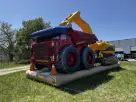 Construction tractor bounce house rental in Houston features a bright yellow excavator arm, ideal for Katy parties.