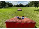 Giant inflatable cornhole rental in Houston—5 feet wide, perfect for Kingwood backyard parties and events with bean bags included.