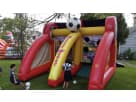 Perfect for Houston birthday parties, this soccer-themed bounce house rental features dual slides and interactive game challenges