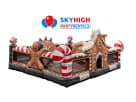 Gingerbread Wonder Playland bounce house rental in Houston featuring candy cane details, climbing structures, and a slide
