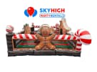 Gingerbread Playland bounce house rental in Houston featuring candy cane stripes, ideal for League City parties.