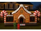 Gingerbread Wonder Playland bounce house rental in Houston with candy cane pillars and slide, ideal for Christmas parties