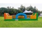 Interactive obstacle course rental in Houston with colorful orange, green, and blue inflatable sections, ideal for Pasadena kids'