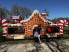 Large gingerbread house bounce castle rental in Houston with dual slides, perfect for Pearland holiday parties and indoor/outdoor