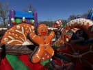 Gingerbread Wonder Playland bounce house rental in Houston with slide and popups, ideal for League City holiday parties.