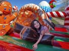 Gingerbread Wonder Playland bounce house rental in Houston with indoor slide — ideal for Sugar Land Christmas parties.