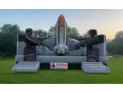 Space-themed bounce house rental in Houston featuring adjustable air flaps, holds up to 4 kids, ideal for birthday parties
