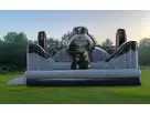 King of the Moon Walk space-themed bounce house rental for Houston with dual slides, perfect for Cypress birthday parties