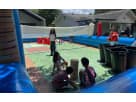 Blue and red modular obstacle course rental in Houston ideal for Katy birthday parties, featuring tunnels and climbing sections