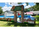 Games castle bounce house rental in Houston with dual slides and interactive elements, ideal for Katy backyard parties.