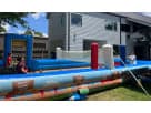 Colorful inflatable obstacle course rental in Houston features blue, red, and gray sections ideal for Katy parties.