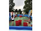 Multicolor interactive lawn games rental in Houston with cornhole and obstacle course stations — ideal for Pearland birthday