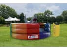 Mechanical Rainbow Shark interactive bounce house rental in Houston with bucking action, ideal for Kingwood parties.