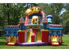 Colorful amusement park obstacle course rental in Houston with rock wall and slides, ideal for Katy birthday parties