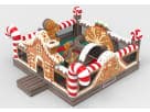 Gingerbread Wonder Playland bounce house rental in Houston with candy cane pillars and slide, ideal for indoor or outdoor