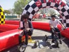 Perfect for Houston team building events, this adult tricycle rental features a checkered obstacle course ideal for riders up